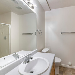 Square Bathroom with tiles flooring and vanity sink with mirror