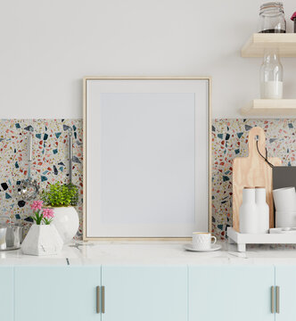 Frame mockup in kitchen interior on marble table in kitchen room.