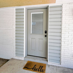 Square Gray front door of a home with digital entry keypad