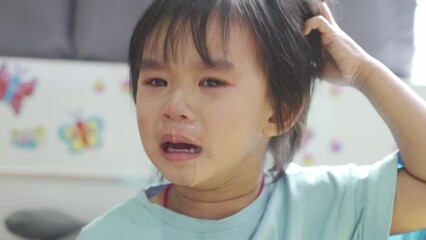 Baby boy was crying and calling his mother on the bed in the bedroom.