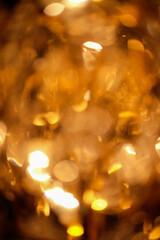 Blurred golden background and glittering light.