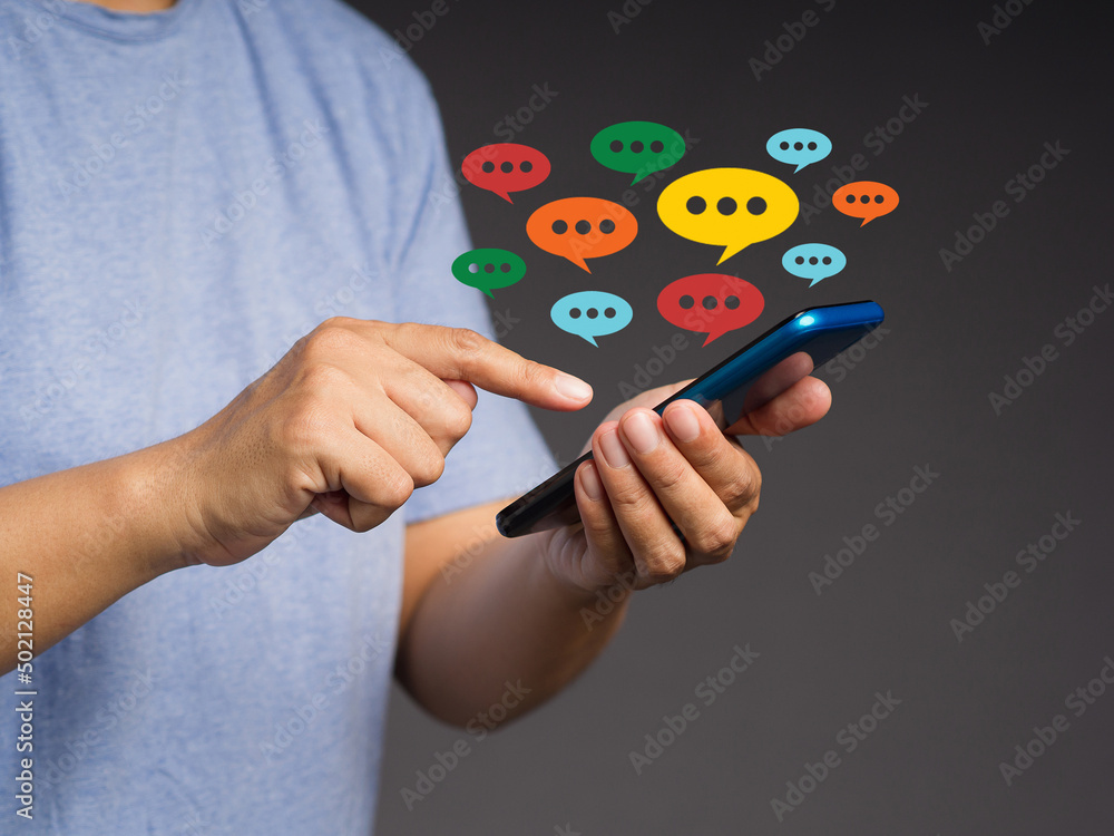 Poster close-up of hands using mobile phone with colorful chat icons on the application