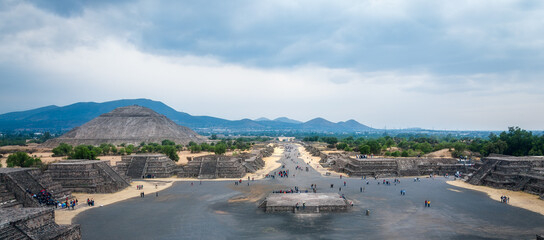 Tourists visit the ruins of the ancient city of Teotihuacán. Perspective view of the Avenue of the...