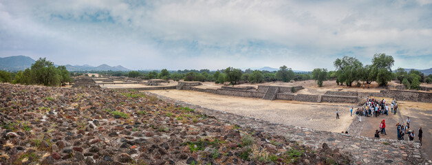 Tourists visit the ruins of the ancient city of Teotihuacán. Panoramic view of the Avenue of the Dead, the main north-south artery in the ancient pre-Aztec City.