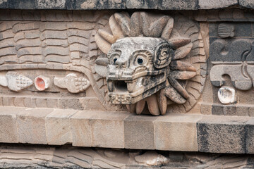 Stone carving details at the Temple of Quetzalcoatl (the Feathered Serpent) at Teotihuacan ancient...