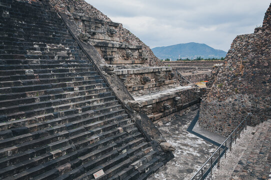 Stairs perspective and carving details at the Temple of Quetzalcoatl (the Feathered Serpent) at Teotihuacan ancient city and archeological site in Mexico-The stepped pyramid is decorated with carvings