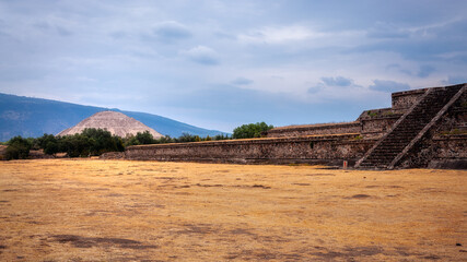 Perspective view at the Citadel, a large plaza at Teotihuacán, a vast archaeological complex in Central Mexico-Pyramid of the Sun in background-The ancient city of Teotihuacan is a World Heritage site