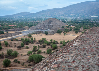Panoramic landscape of the Pyramid of the Moon, at Teotihuacan, an ancient pre-Aztec City and archeological site in Central Mexico. View from above on top of the Pyramid of the Sun.