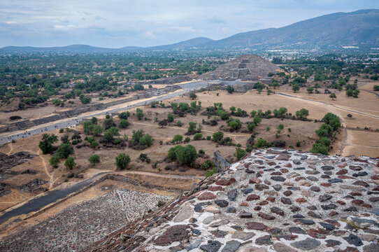 Perspective looking at the Pyramid of the Moon, at Teotihuacan, an ancient pre-Aztec City and archeological site in Central Mexico. View from above on top of the Pyramid of the Sun.
