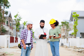 Arab man and team working. Professional woman and man. African American mixed-race people. Construction worker and business owner working on digital tablet computer in construction site