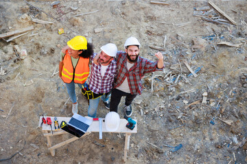 Hand together top view. Successful teamwork unity. Mechanical Engineer and construction team at...