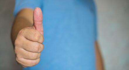 Man showing thumbs up sign with copy space