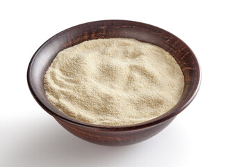 Semolina flour in ceremic bowl isolated on white background with clipping path