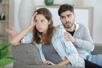 man pleading with woman after an argument