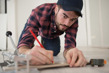 carpenter working in woodworking workshop