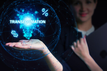 Business, Technology, Internet and network concept. Young businessman working on a virtual screen of the future and sees the inscription: Transformation