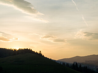 Sunset in Carpathian mountains. Evening in Bukovel, Ukraine. Beautiful natural landscape. Evening light illuminates the valley. Discover the beauty of earth. Silhouette