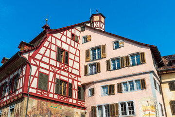 Historical tenement house (apartment building) with facade paintings and half timbered walls in an old town in Swiss city Stein am Rhein in Switzerland 

