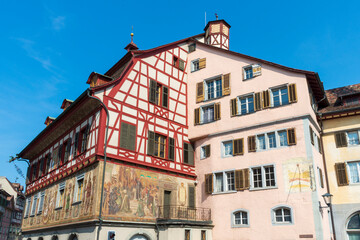 Fototapeta na wymiar Historical tenement house (apartment building) with facade paintings and half timbered walls in an old town in Swiss city Stein am Rhein in Switzerland 