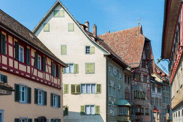 Fototapeta premium Historical tenement house (apartment building) with facade paintings and half timbered walls in an old town in Swiss city Stein am Rhein in Switzerland 