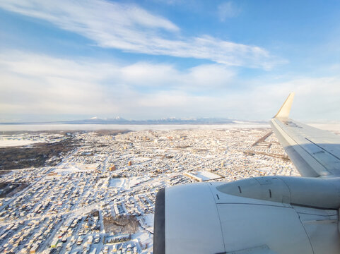 Snowy towns viewed from an airplane (Chitose, Hokkaido, Japan)