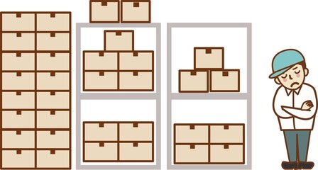 倉庫で腕を組み、考え事をする帽子をかぶった作業員の男性。