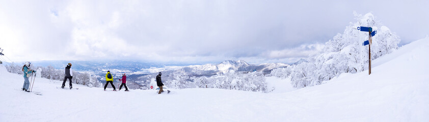 Fototapeta na wymiar Slopes in a cloudy ski resort (Zao-onsen ski resort, Yamagata, Japan)
