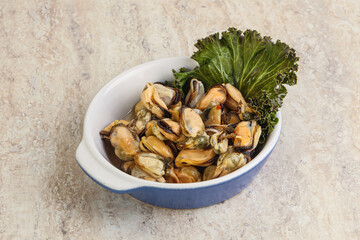 Tasty marinated mussels in the bowl