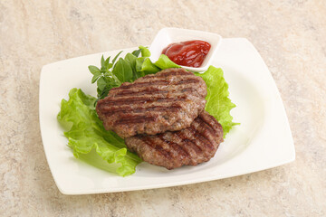 Grilled beef burger cutlet with sauce