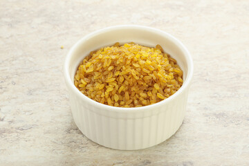Raw bulgur in the bowl