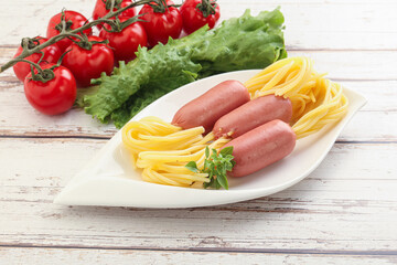 Mini sausages with pasta spaghetti