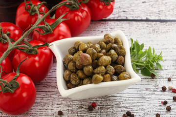 Marinated green capers in the bowl