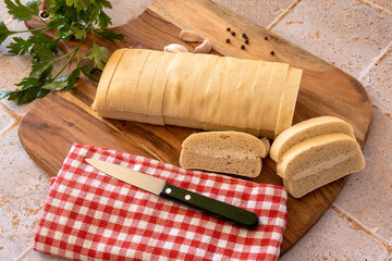top view of a topped bread on a wooden board