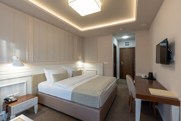 Interior of a luxury hotel double bed bedroom