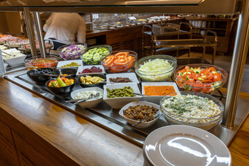 Breakfast served on a buffet table in a hotel restaurant