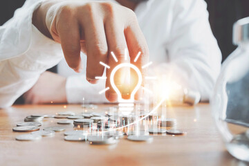 saving energy and money concept. idea for save or investment. saving money concept putting money coin stack growing business and graph growing concept.