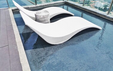 Obraz premium Softseats on the edge of the pool with Waves on the water surface The water ripples in the pool and overlooking blurred bright blue ceramic tiles that cover the floor of the pool with selective focus 