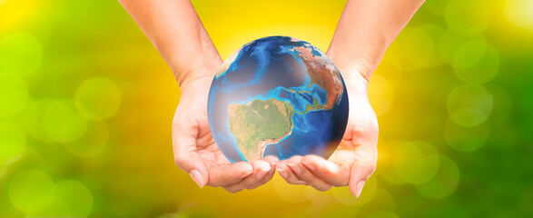 woman holding planet with both hands for earth day and energy saving environment concept Elements of this image from NASA.