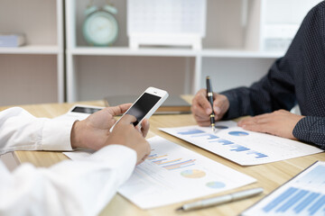 Brainstorm team, Marketers and financial accountants are discussing and analyzing charts to plan a company's growth and development strategy, Team meetings or business consulting, Business profit.