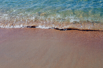the shoreline of the beach. sandy and pebble beach. the sea wave.