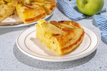 Classic upside-down apple cake. Retro apple cake recipe, cooked in frying pan easy autumn summer homemade baking sweet pastry, with fresh green apples copy space