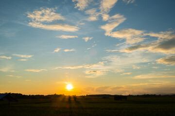 Colorful sunset and sunrise with clouds. Blue and orange color of nature. Many white clouds in the blue sky. The weather is clear today. sunset in the clouds. The sky is twilight.