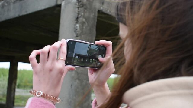person taking a picture of a camera