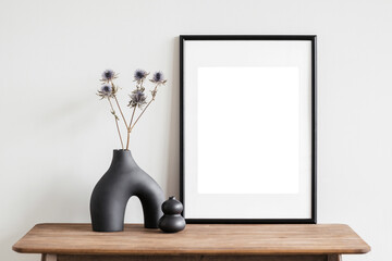 Blank picture frame mockup on white wall. White living room design. View of modern scandinavian style interior with artwork mock up on wall. Home staging and minimalism concept - obrazy, fototapety, plakaty