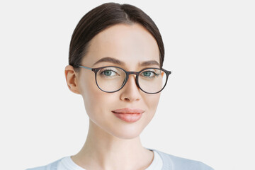 Young beautiful woman isolated portrait, Student girl wearing glasses closeup studio shot, Young...