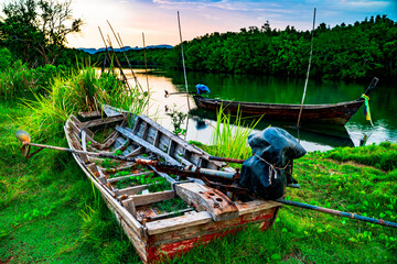 The broken ship, an Old abandoned ship on the ocean shore.Thai wooden motorboat.