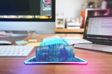 Workplace desk with digital visual hologram neon city and home office background