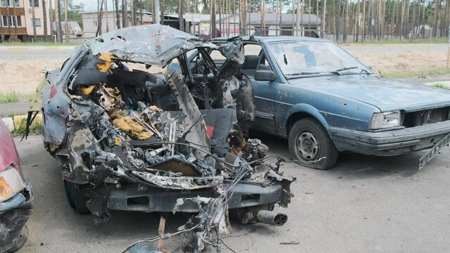 Irpin, a crushed and shelled car, the consequences of the Russian army's invasion of Ukraine. War in Ukraine