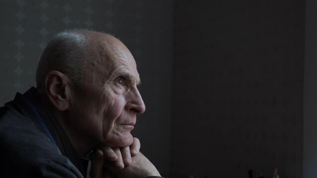 Old sullen man with wrinkled face looking with sad and reason. Dementia and alzheimer illness problems concept.