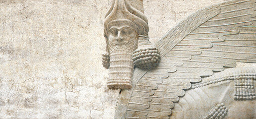 Grunge background with stone texture and lamassu. Horizontal banner with assyrian protective deity